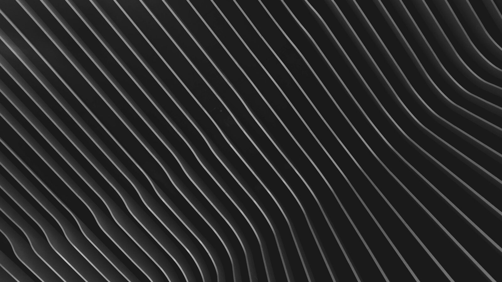 a black and white abstract background with wavy lines